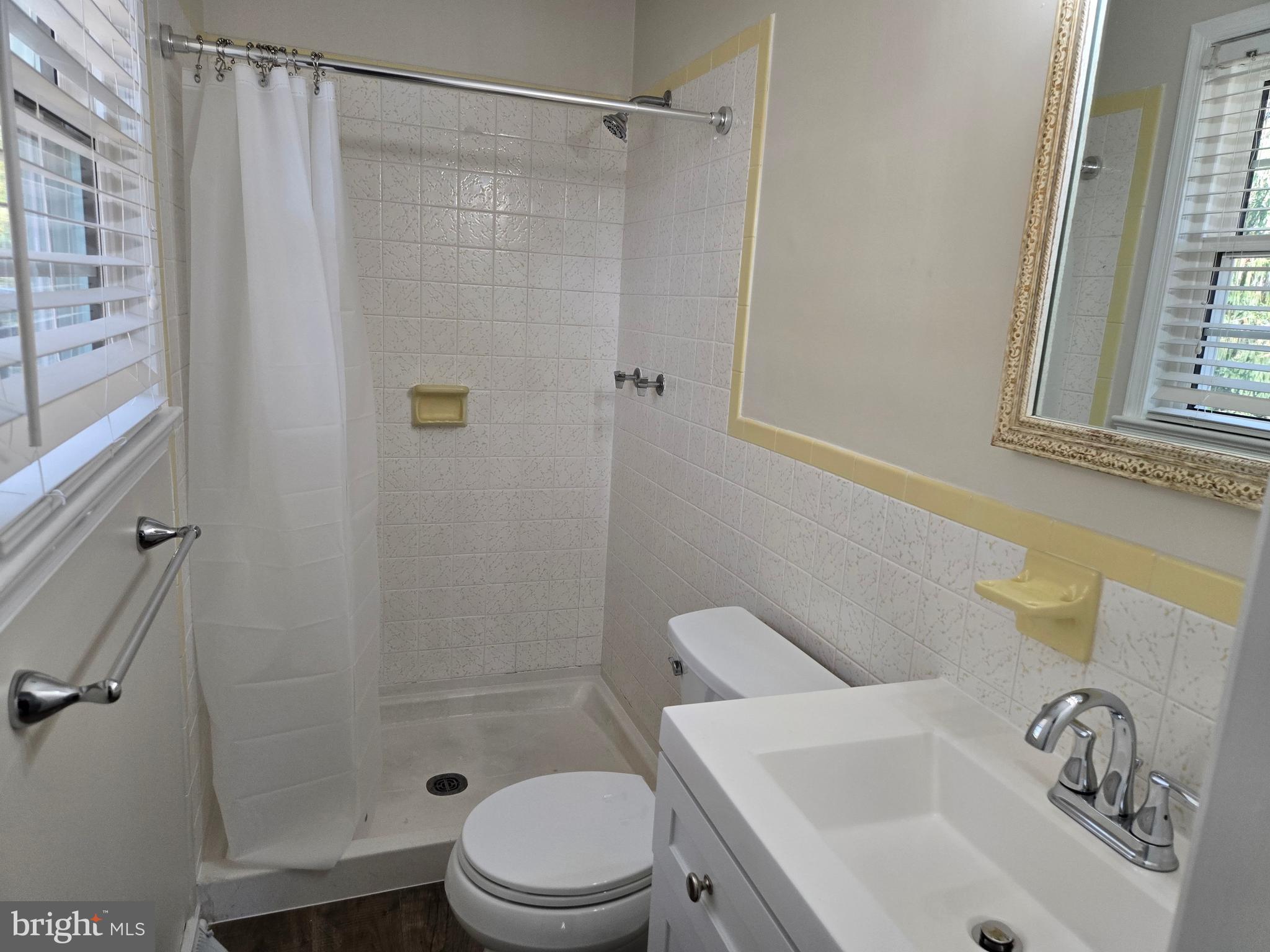 341 South 26th Street, Unit A Purcellville, VA 20132 - Photo 27 of 33 a bathroom with a sink toilet and shower