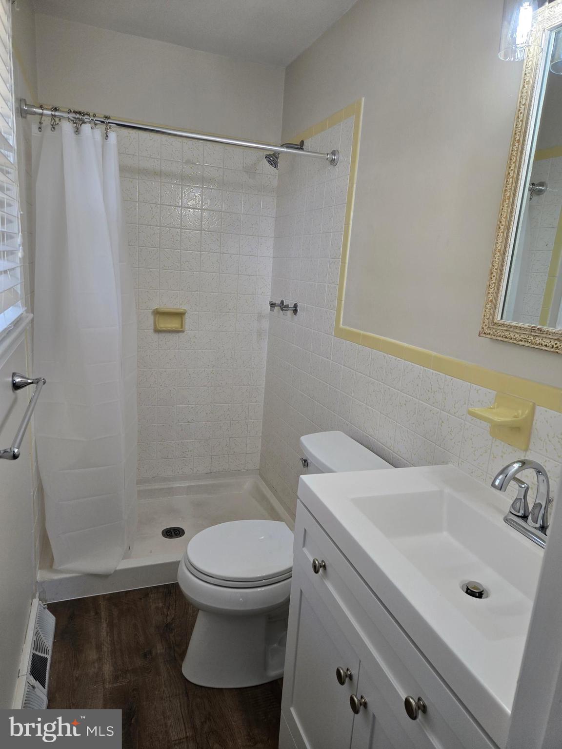 341 South 26th Street, Unit A Purcellville, VA 20132 - Photo 28 of 33 a bathroom with a sink a toilet and shower
