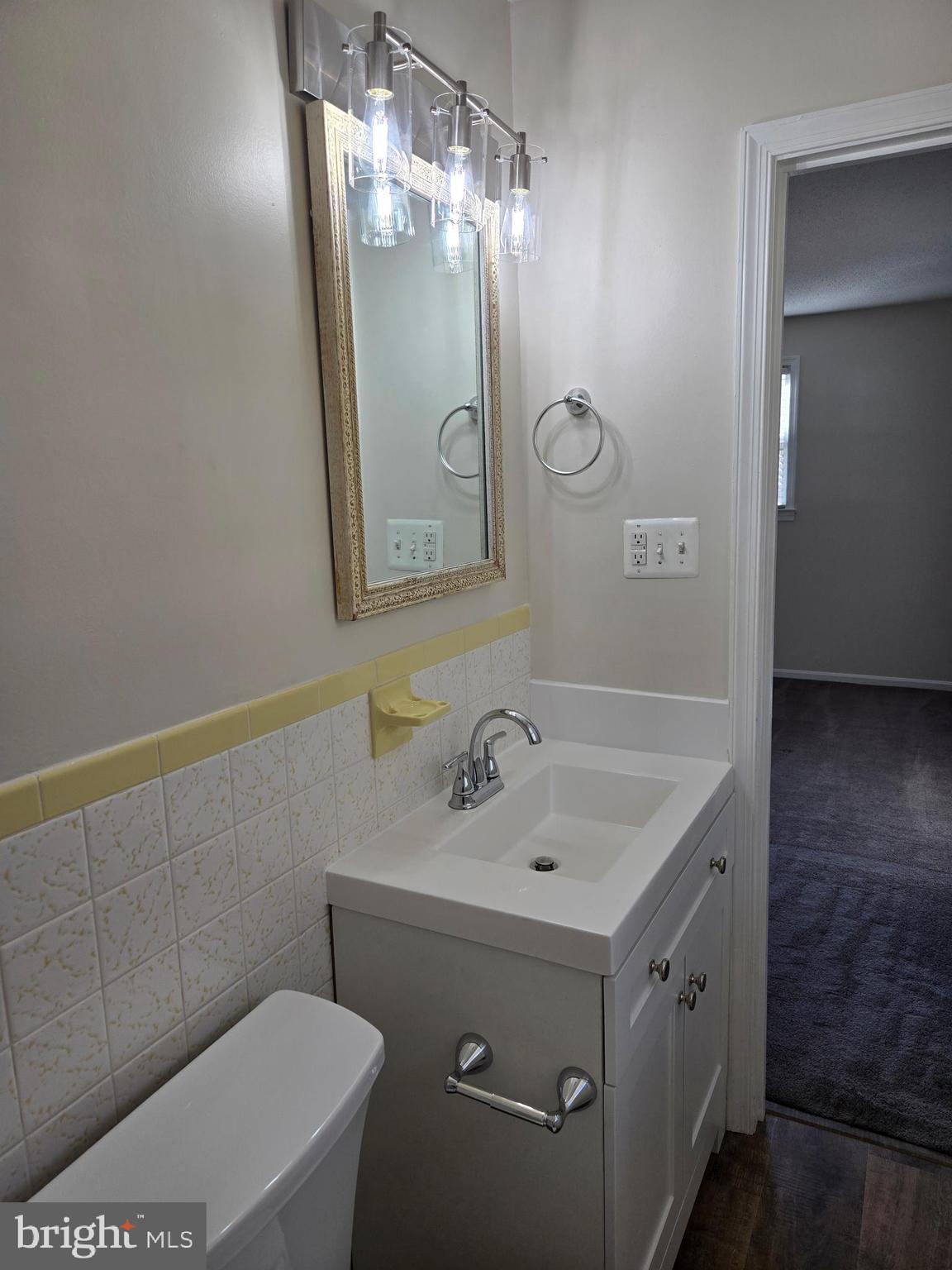 341 South 26th Street, Unit A Purcellville, VA 20132 - Photo 29 of 33 a bathroom with a sink a toilet and shower