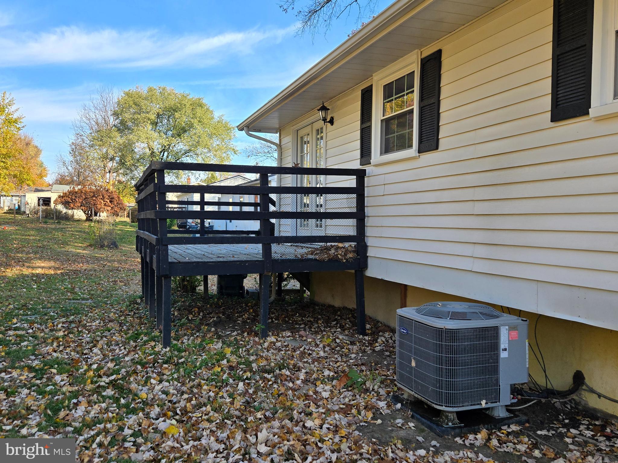 341 South 26th Street, Unit A Purcellville, VA 20132 - Photo 6 of 33 a wooden bench sitting in front of a house