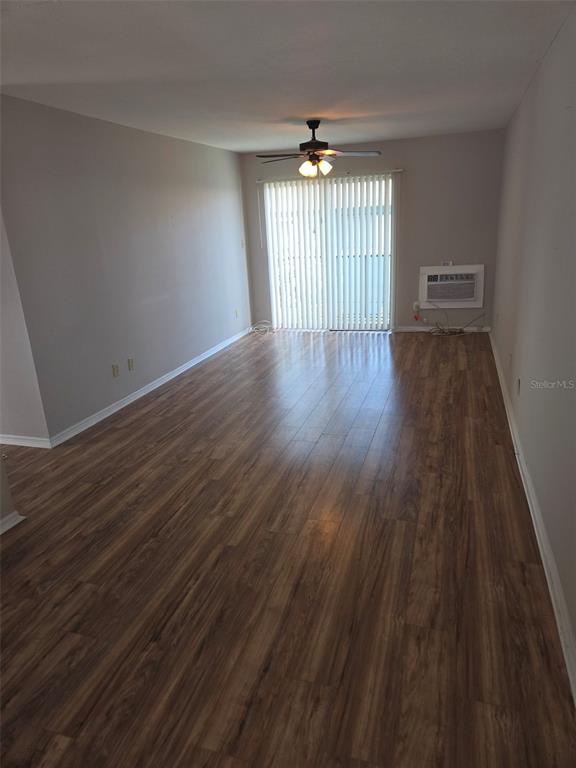 3101 Bee Ridge Road, Unit 204 Sarasota, FL 34239 - Photo 5 of 7 wooden floor in an empty room