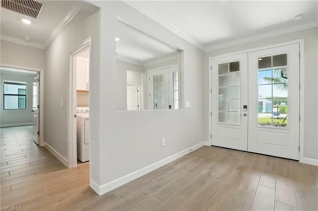 a bedroom with a large bed and a flat screen tv