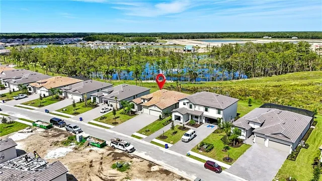 an aerial view of a house with a ocean view