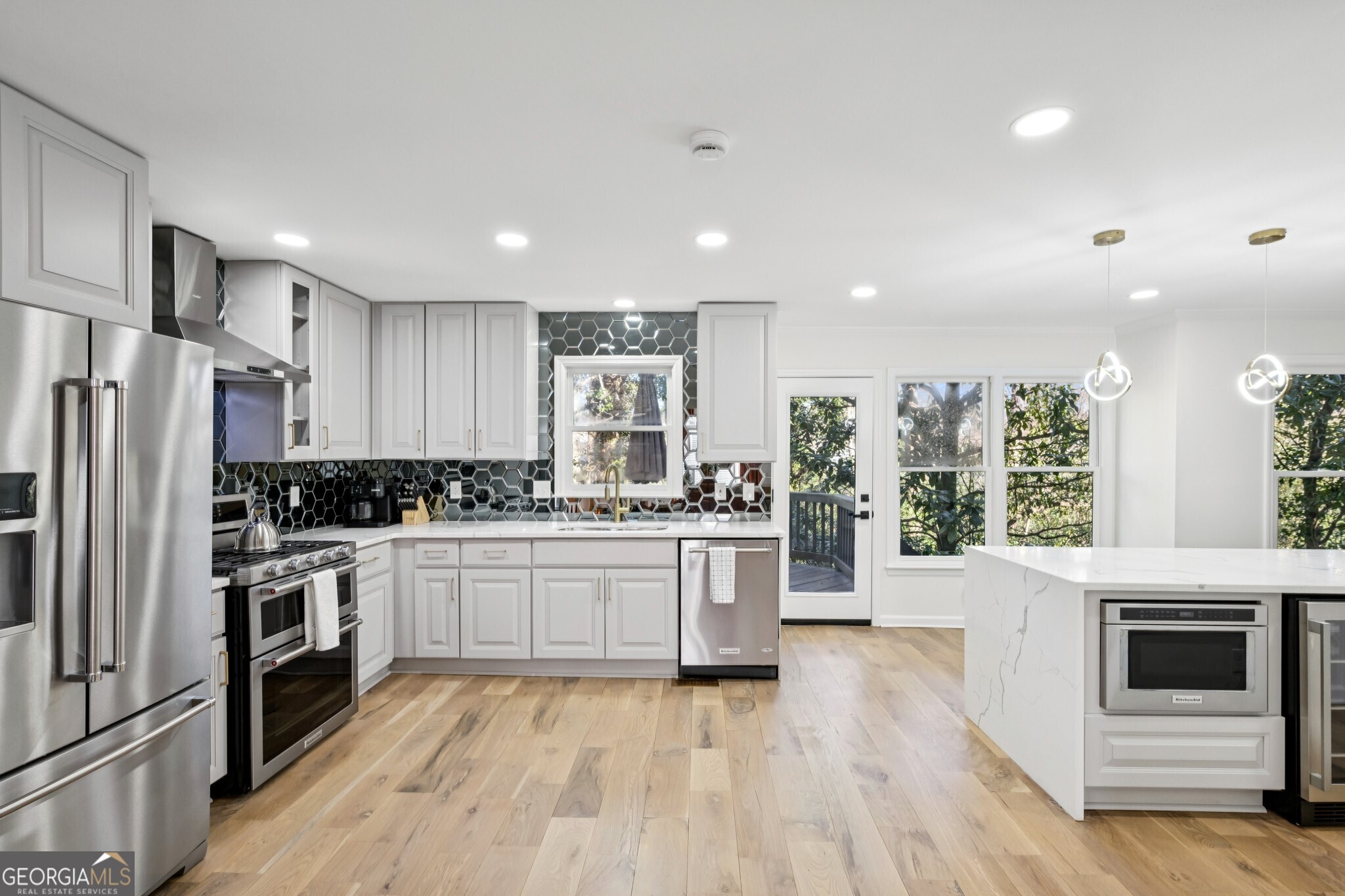 1810 Fairoaks Road Decatur, GA 30033 - Photo 3 of 52 Renovated Kitchen With Shaker Cabinets, Custom Tile Backsplash, & Waterfall Island With Seating