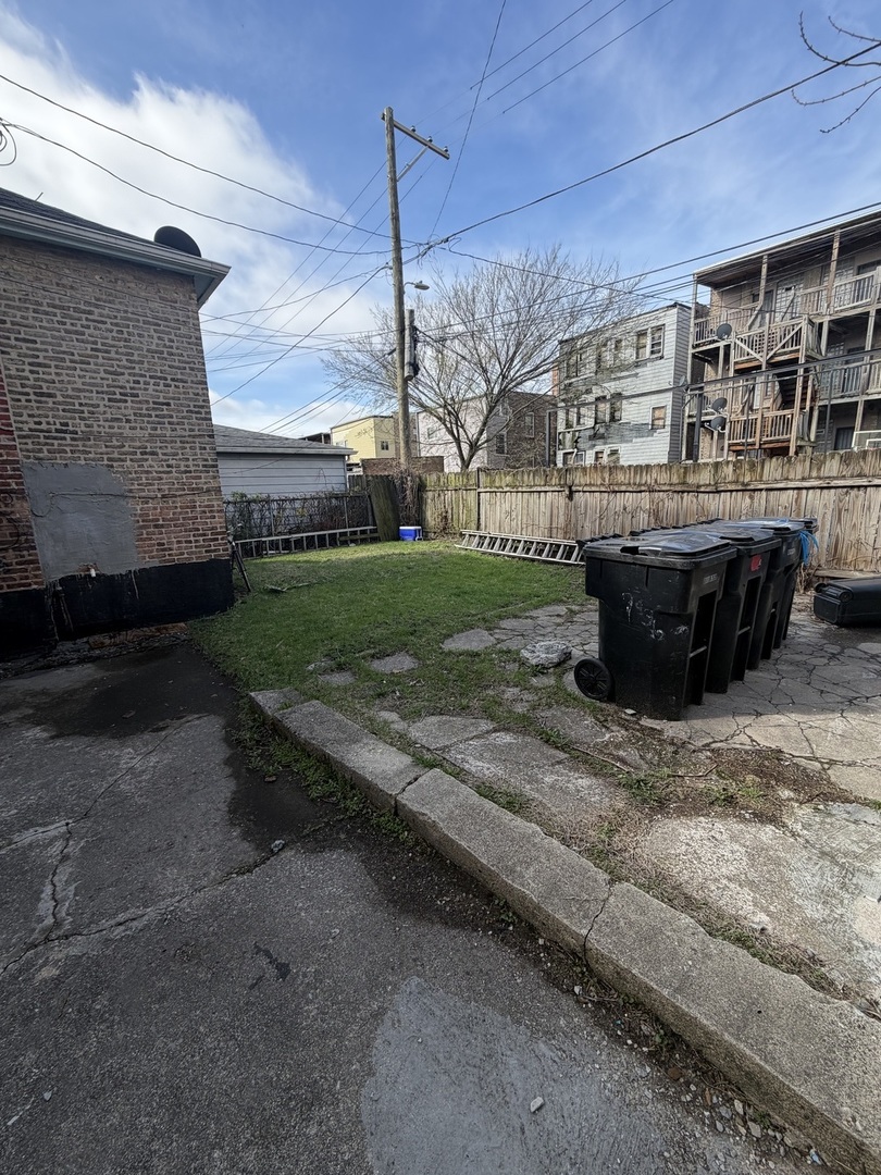 7316 South Lowe Avenue Chicago, IL 60621 - Photo 12 of 16 a view of a backyard with plants
