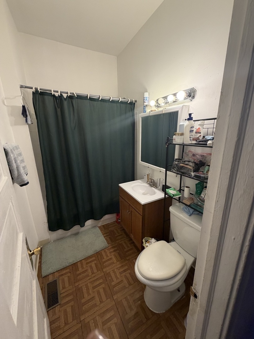 7316 South Lowe Avenue Chicago, IL 60621 - Photo 4 of 16 a bathroom with a toilet and a sink