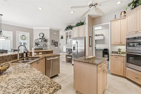 a kitchen with appliances cabinets and a counter top space