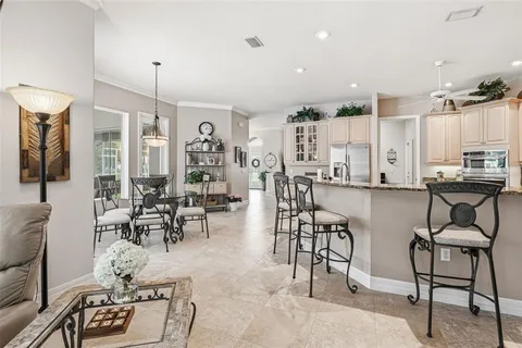 a living room with furniture fireplace and flat screen tv