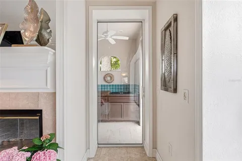 a spacious bedroom with a bed a dresser and cabinets