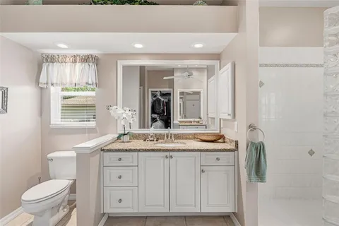 a view of walk in closet with clothes