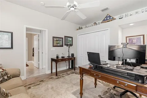 a dining room with furniture and a window
