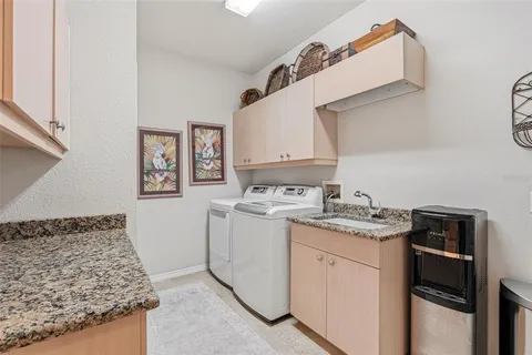 a bathroom with a toilet sink vanity and mirror
