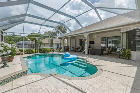 a front view of a house with a yard table and chairs