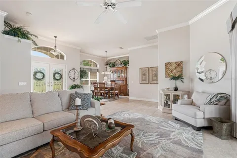 a kitchen with cabinets and chairs
