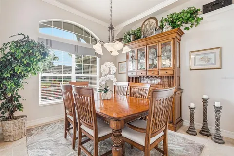 a kitchen with kitchen island granite countertop a sink counter top space appliances and cabinets