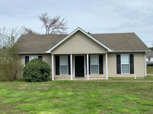 front view of a house with a garden