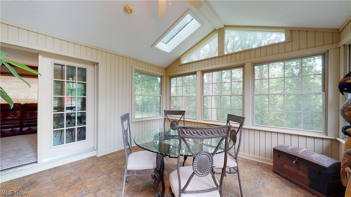 2549 Sourek Road Akron, OH 44333 - Photo 13 of 28 Off the eat-in-kitchen and the family room is the Four Season Room with LARGE windows! This room is at the heart of the home. You will love its high beamed ceilings and cozy "escape-to place" feel!