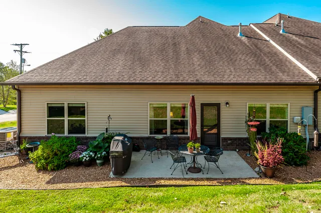 a front view of house with outdoor seating
