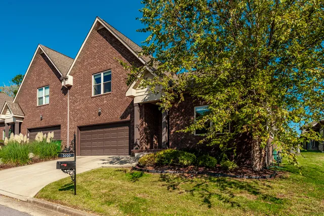 a view of house with yard
