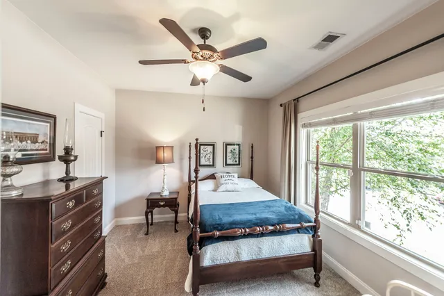 a bedroom with a bed and a dresser