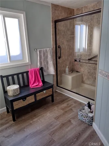 a spacious bathroom with a bathtub and a shower