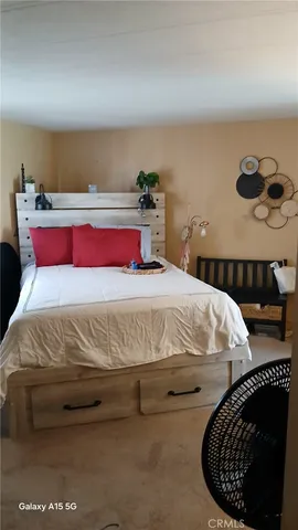 a bedroom with a bed and window