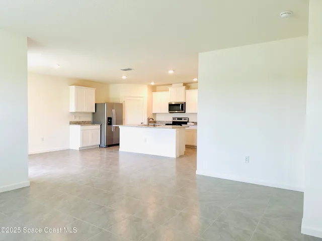 a view of a kitchen with a sink