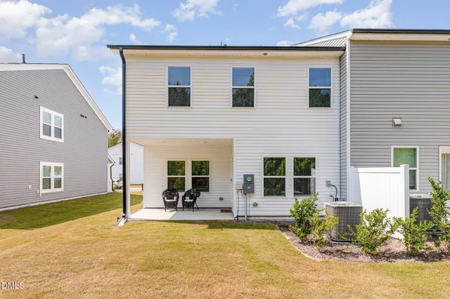 a view of a house with dining room and swimming pool