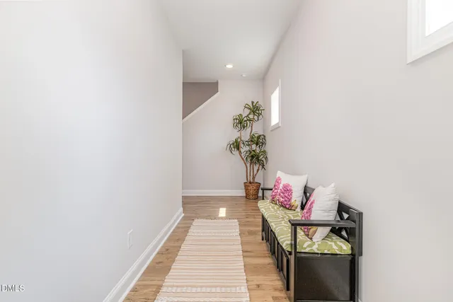 a living room with furniture and flowers