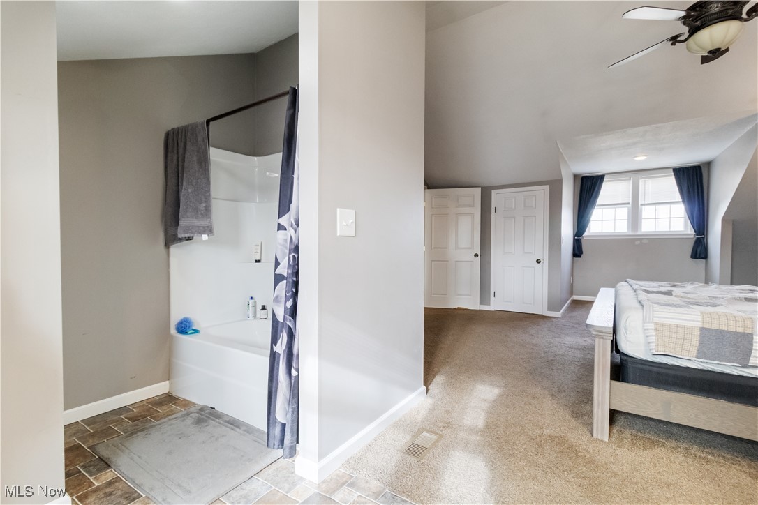 57459 Shry Road Barnesville, OH 43713 - Photo 16 of 44 Full bathroom with ceiling fan and shower / bath combo
