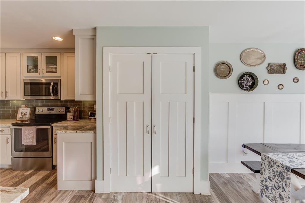 18 Raven Ridge Jefferson, GA 30549 - Photo 17 of 47 a kitchen with stainless steel appliances granite countertop a refrigerator and a stove top oven