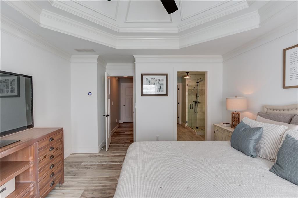 18 Raven Ridge Jefferson, GA 30549 - Photo 20 of 47 a bedroom with a bed and a flat tv screen on dresser