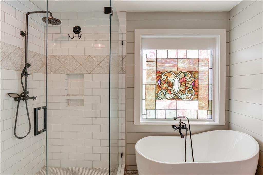 18 Raven Ridge Jefferson, GA 30549 - Photo 22 of 47 a bathroom with a tub and a shower