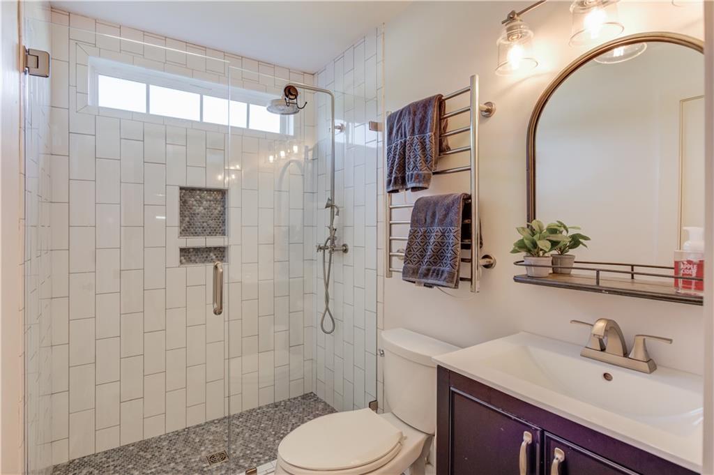 18 Raven Ridge Jefferson, GA 30549 - Photo 25 of 47 a bathroom with a sink a toilet and shower