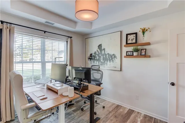 a workspace with furniture and a window