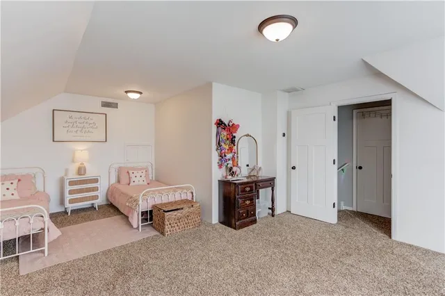 a view of living room filled with furniture and lamp