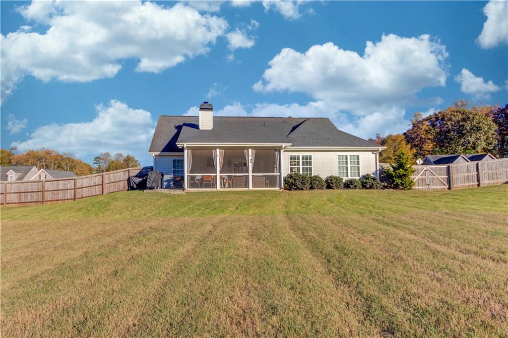 18 Raven Ridge Jefferson, GA 30549 - Photo 39 of 47 a front view of a house with a garden