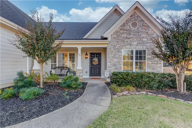a front view of a house with garden