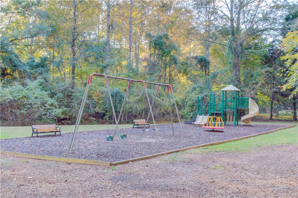 18 Raven Ridge Jefferson, GA 30549 - Photo 46 of 47 a backyard of apartments with large trees