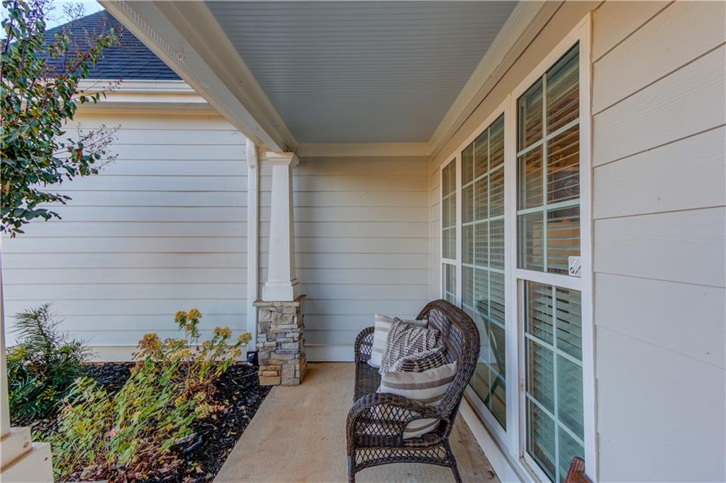 18 Raven Ridge Jefferson, GA 30549 - Photo 5 of 47 a view of a chair and table in the balcony