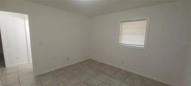 an empty room with white cabinet