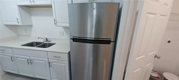 a white toilet sitting next to a bathroom sink