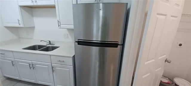 a white toilet sitting next to a bathroom sink