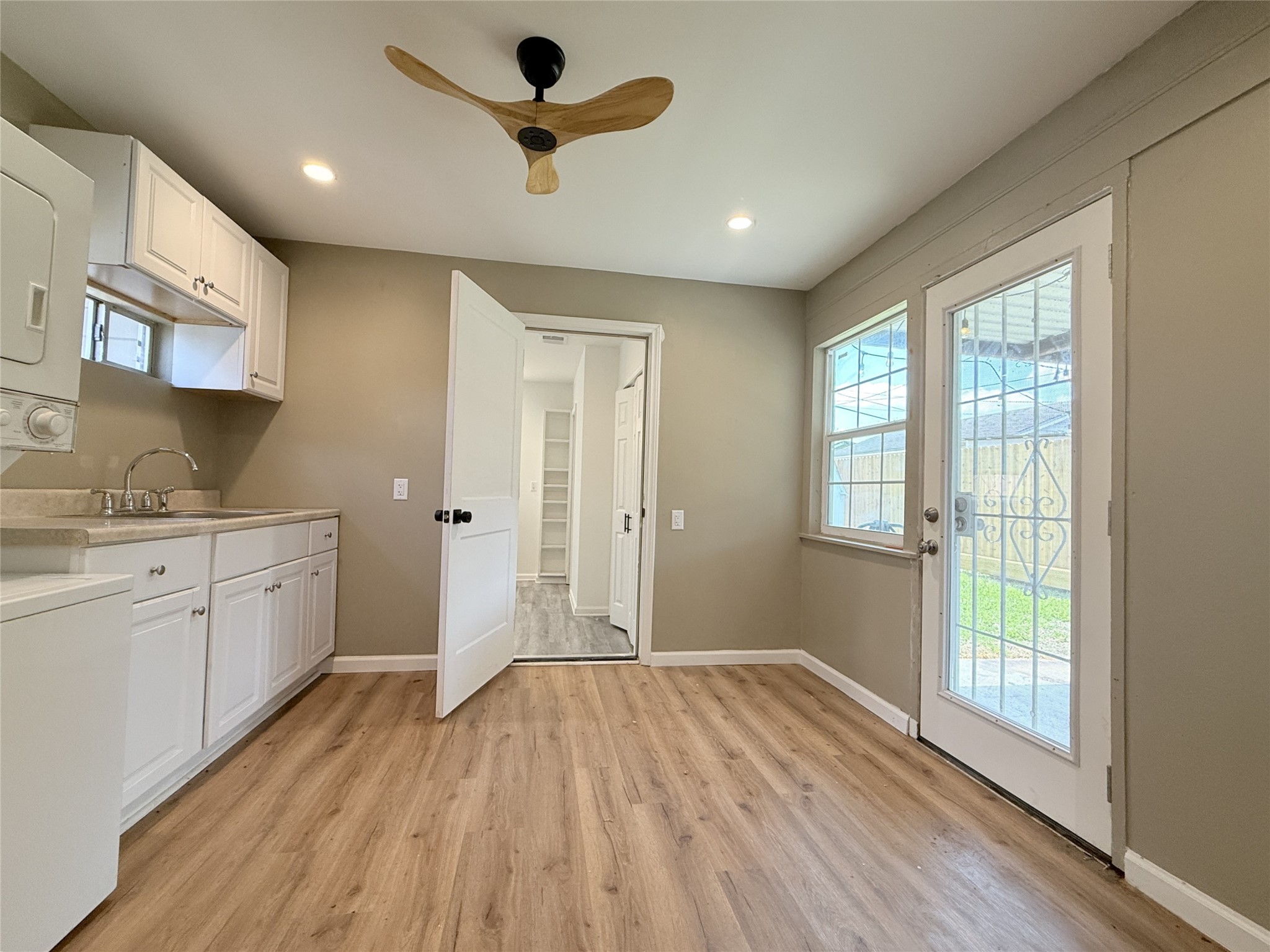 1922 Tabor Street Houston, TX 77009 - Photo 8 of 24 In the laundry/mudroom, a door opens in from the primary bedroom. A glass paned door opens in from a covered patio.