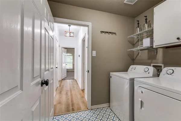 a view of hallway with washer and dryer