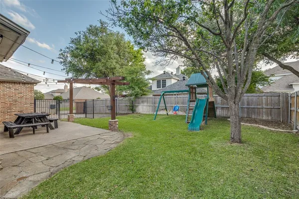 a view of a backyard with a slide