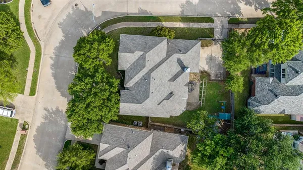 an aerial view of a house with a garden