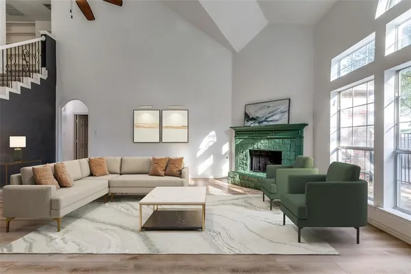 a living room with furniture and a fireplace