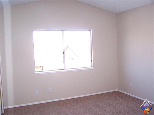 1241 Kings Road Palmdale, CA 93551 - Photo 13 of 21 an empty room with a window