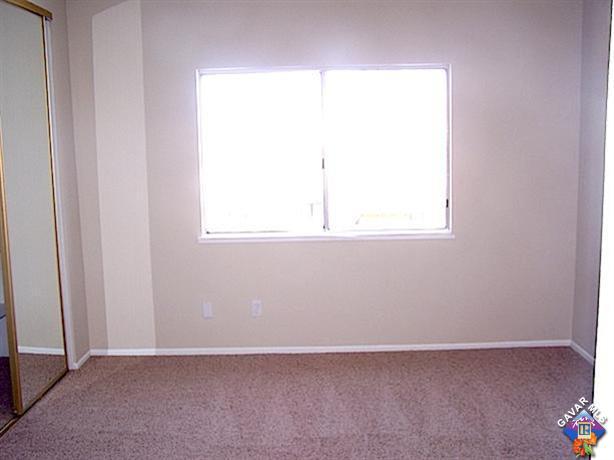 1241 Kings Road Palmdale, CA 93551 - Photo 14 of 21 an empty room with a window